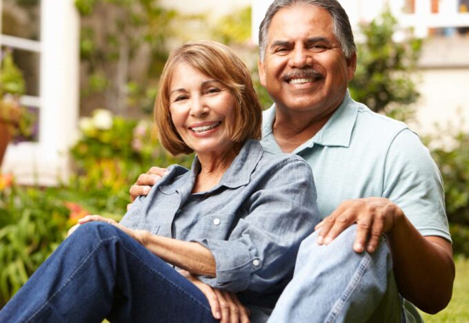 Couple sitting outside.