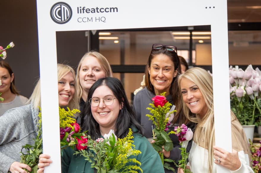 Group of employees pose together during employee appreciation day at CrossCountry Mortgage headquarters in Cleveland, Ohio.