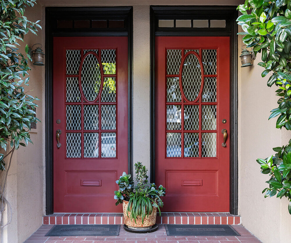 Front door of duplex home purchased for house hacking.
