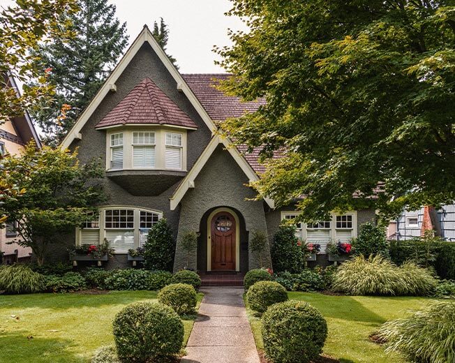 Exterior of a stucco home in a neighborhood where homes sell fast.