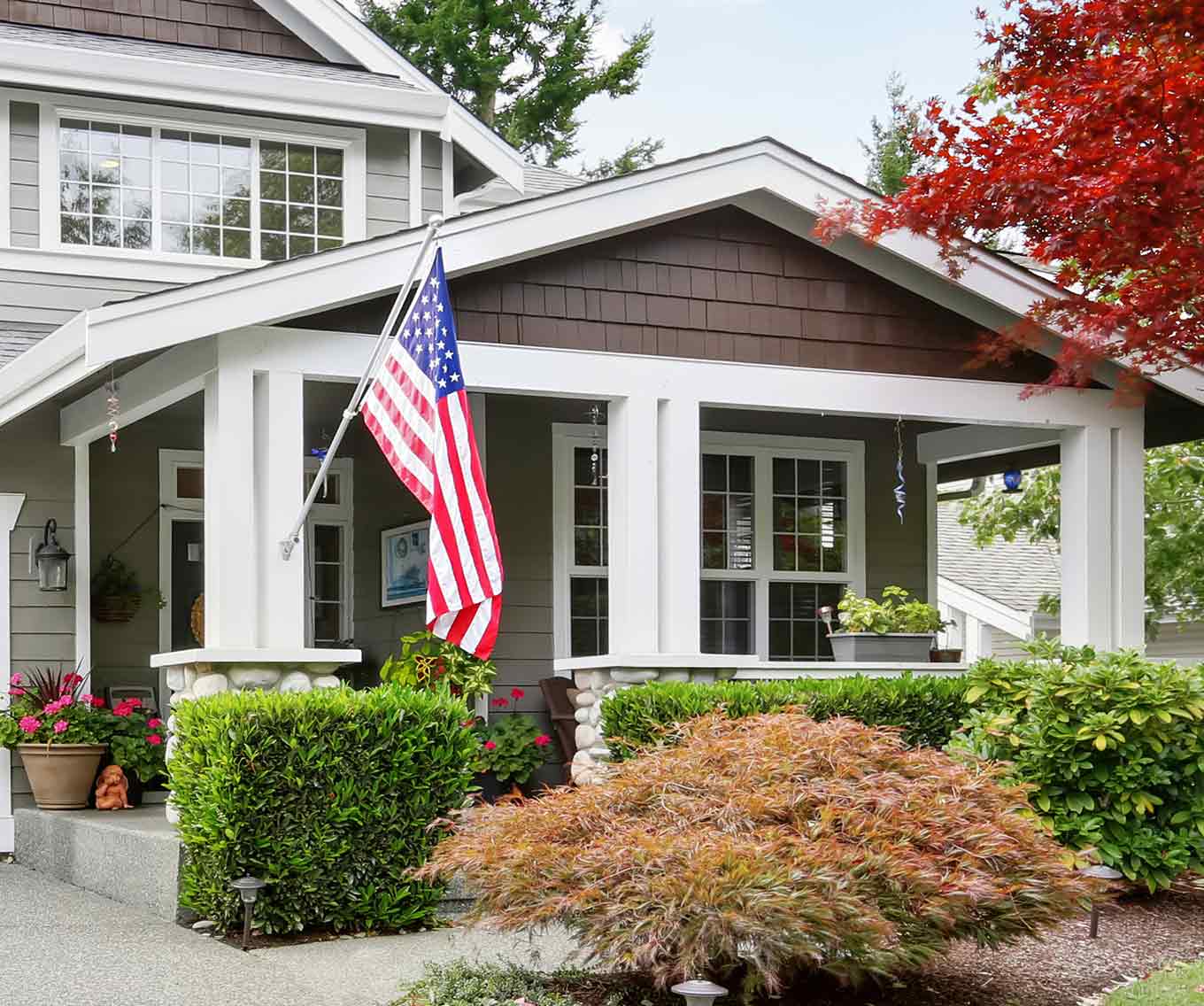 Bungalow house with an American flag.