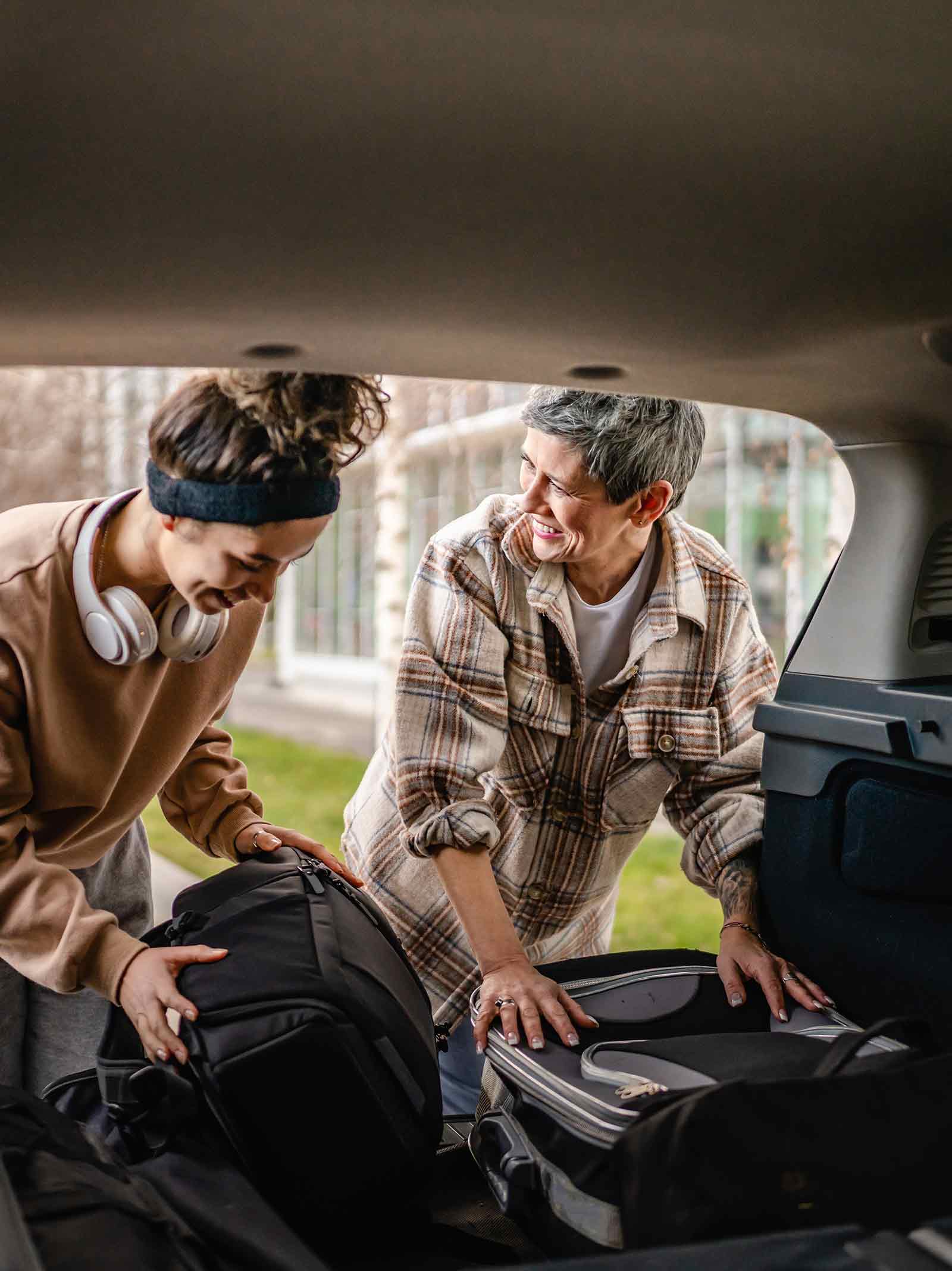 Mother and daughter pack their car for a move to college financed using an fha cash-out refinance.
