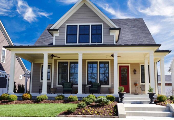 Outside the front of a suburban home purchased using a conventional loan.