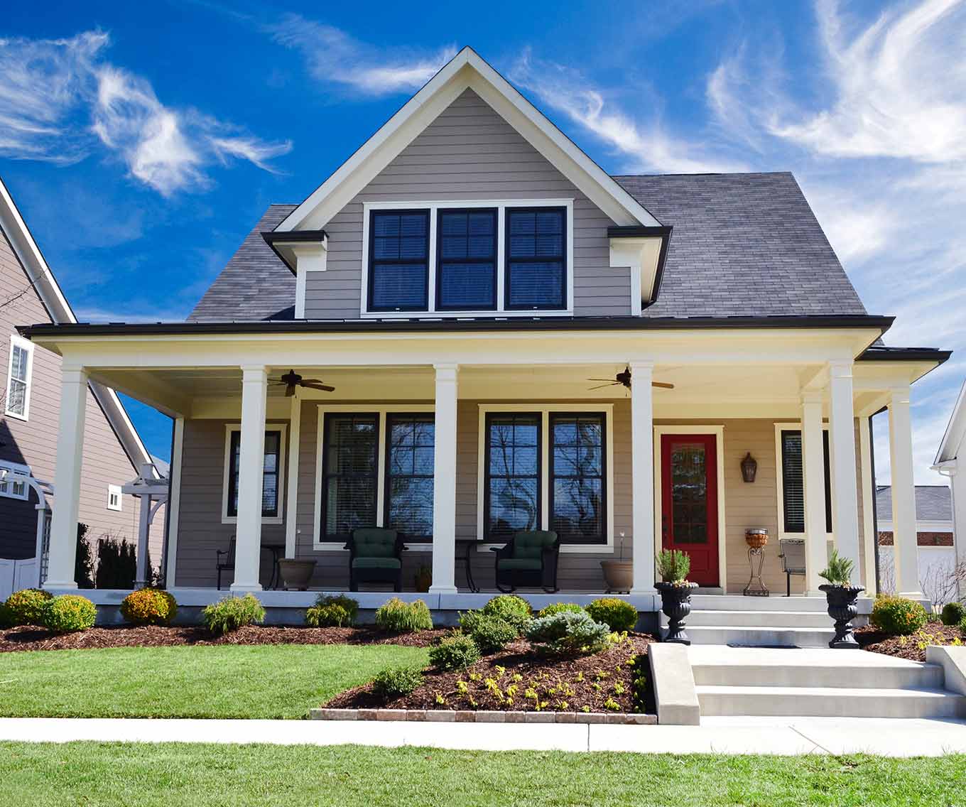 Outside the front of a suburban home purchased using a conventional loan.